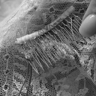 Veil comb on lace