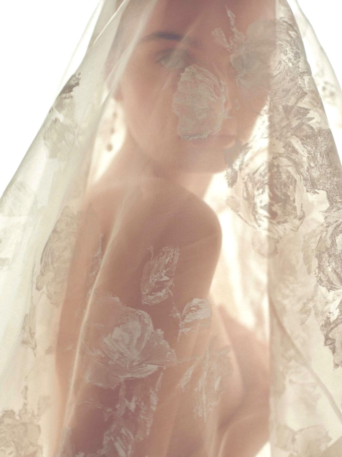Bride beneath a floral organza veil