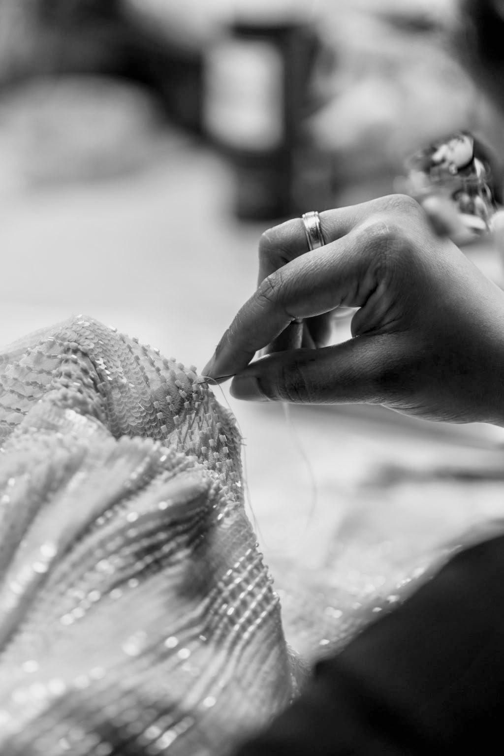 Hand-beading a gown