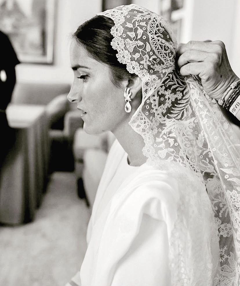 Mantilla veil being placed
